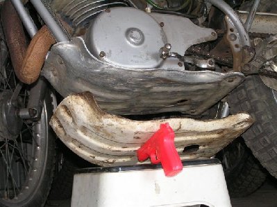 Original A model plate under B model aluminium plate on bike