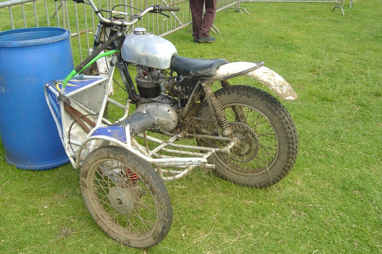 A muddy BSA sidecar outfit