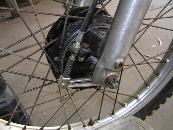 Front end as it came. Odd wheel, backing plate and forks