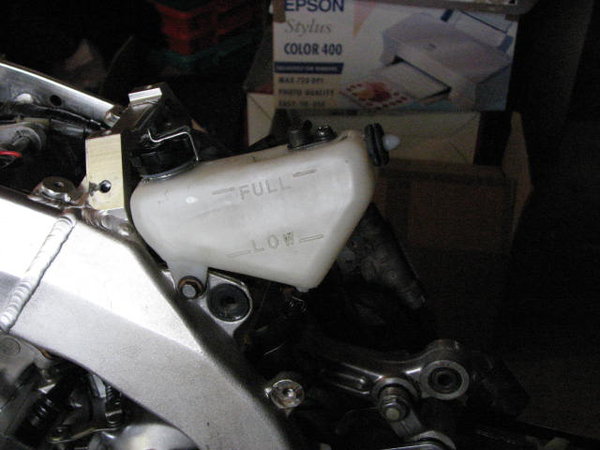 Oil tank mounted on frame