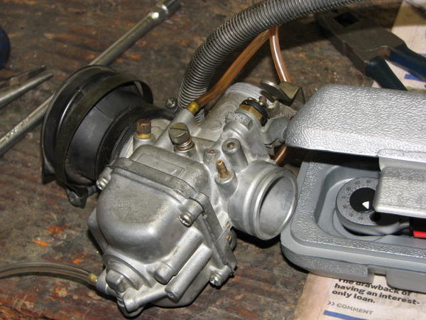 Carb showing brass inlet on engine side